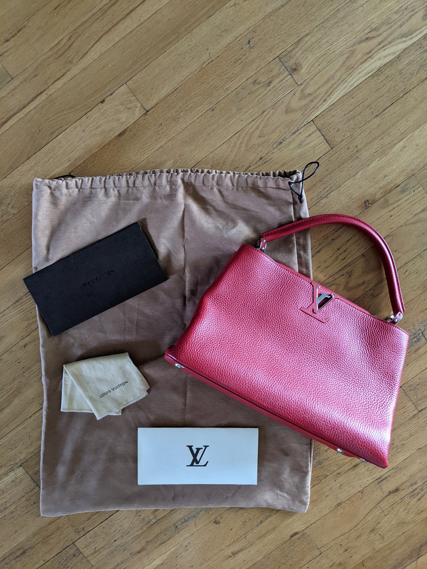 Louis Vuitton Capucines MM two way bag in Ruby Red.